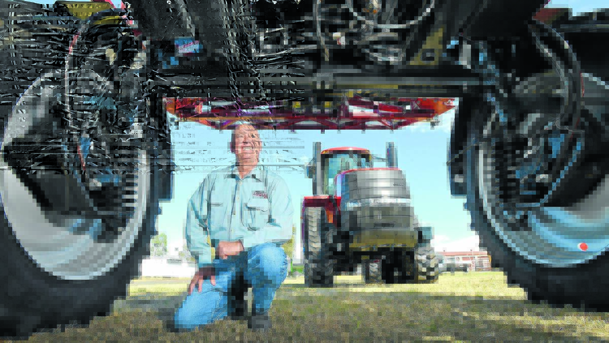 AGQUIP STARTS ON TUESDAY: Barry Harley, Rural Press Events general manager, under a Case IH 3330 Patriot spraying vehicle with a Case IH AFS 500 Quadtrac behind, is excited that the most number of exhibitors ever will be at this year’s 42nd event. Photo: Barry Smith 130814BSD04