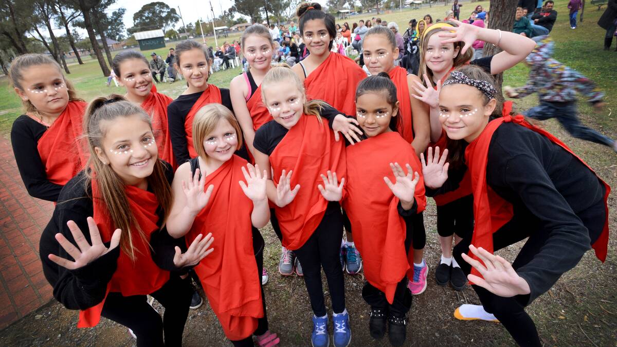 IT'S NAIDOC WEEK: The Gems and The Sapphires at yesterday’s opening ceremony – back, from left, Alyce Jerrard, 11, Dykota Hammond, 11, Pyper Allan, 10, Lacey Gibson, 11, Kadija Naden, 11, Charra Reid, 10, and Allee Farrell, 12. Front, from left, Maddison Johnson, 13, Ayeisha Finly, 7, Ava Morris, 8, Ivy West, 7, and Barbara Jerrard, 13. Photo: Gareth Gardner 060714GGB01