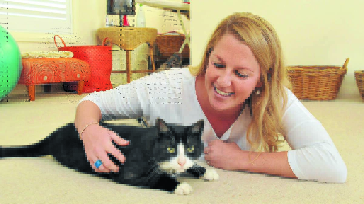 WILD THING: Pip Ash is crazy about her cat Middy. Photo: Geoff O’Neill 080714GOC01