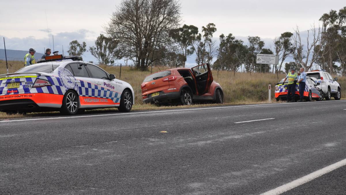CHASE ENDS: A man was arrested on the side of the New England Highway south of Armidale yesterday afternoon after police had to deploy road spikes to try and stop a Kia Sportage. Photo: Armidale Express