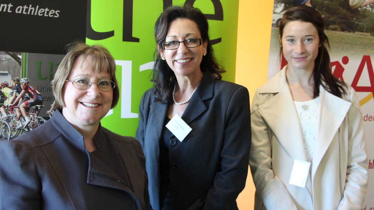 UNE vice chancellor Professor Annabelle Duncan,  NIAS executive officer Di Hallam, and Holly Harris, the Australian U23 Cross Country Mountain Bike Champion, an assistant coach at NIAS and UNE student and a sporting scholarship holder at this week's three-year partnership extension.