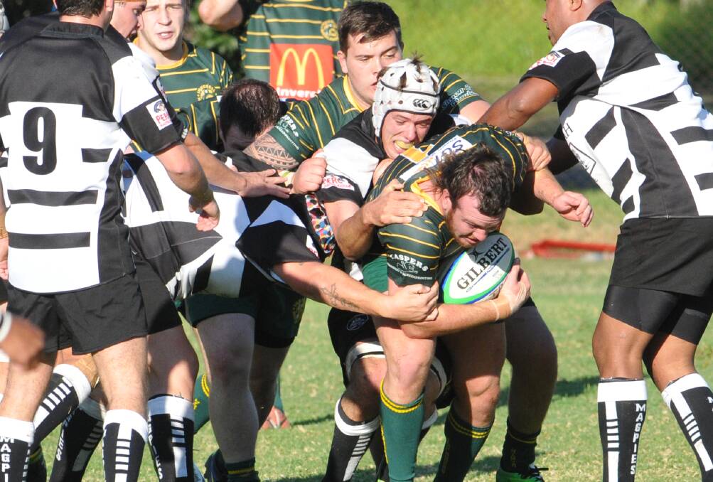 Inverell prop Tom Apthorpe drags Tamworth’s John Herdegen with him on this charge. Photo: Geoff O’Neill 240514GOD03