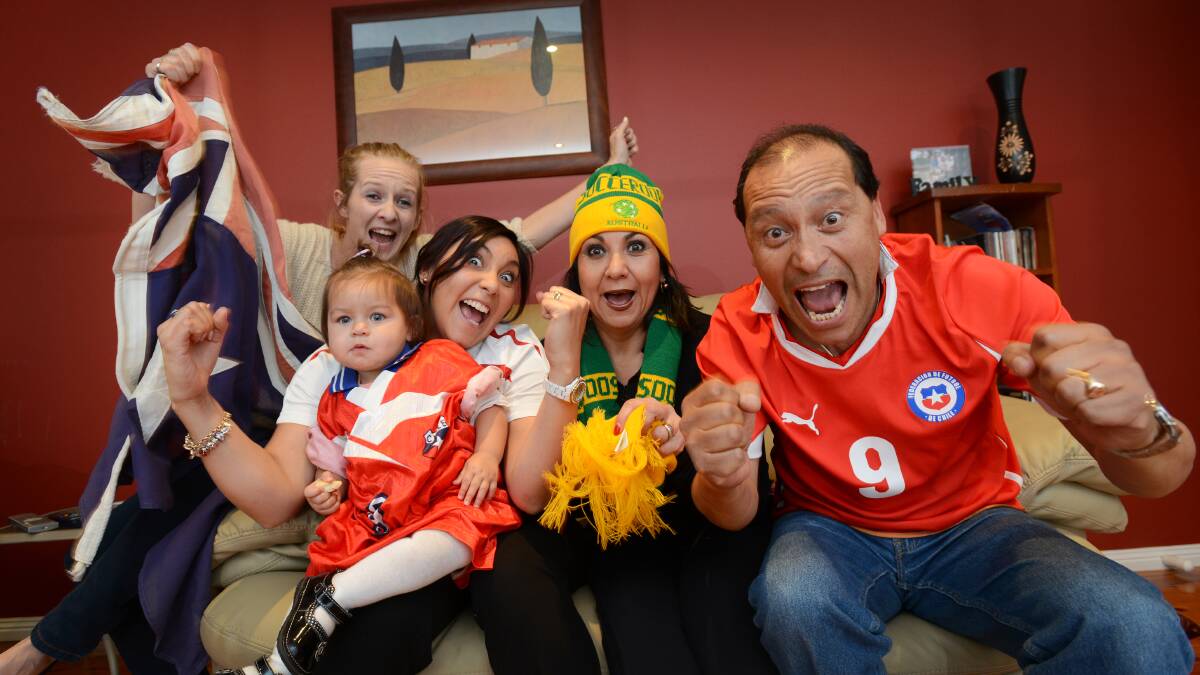 OWN GOAL: Calala’s Soto family – granddaughter Lucy Soto, daughter Diana Davis, mum Jessica Soto, dad 
Carlos Soto and (back) 
Lucy’s mum Fiona McKnight–are torn between barracking for Chile or 
Australia in tomorrow’s soccer World Cup clash. Photo: Geoff O'Neill 120614GOB01