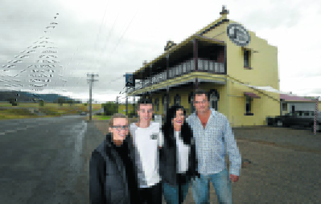 RICH HISTORY: The new owners of the 177-year-old Currabubula Pub – Regan Dodd, Lachlan Dodd, Kathy Dodd and Wayne Smith – are thrilled to start a fresh chapter in their lives. Photo: Gareth Gardner 260415GGA02