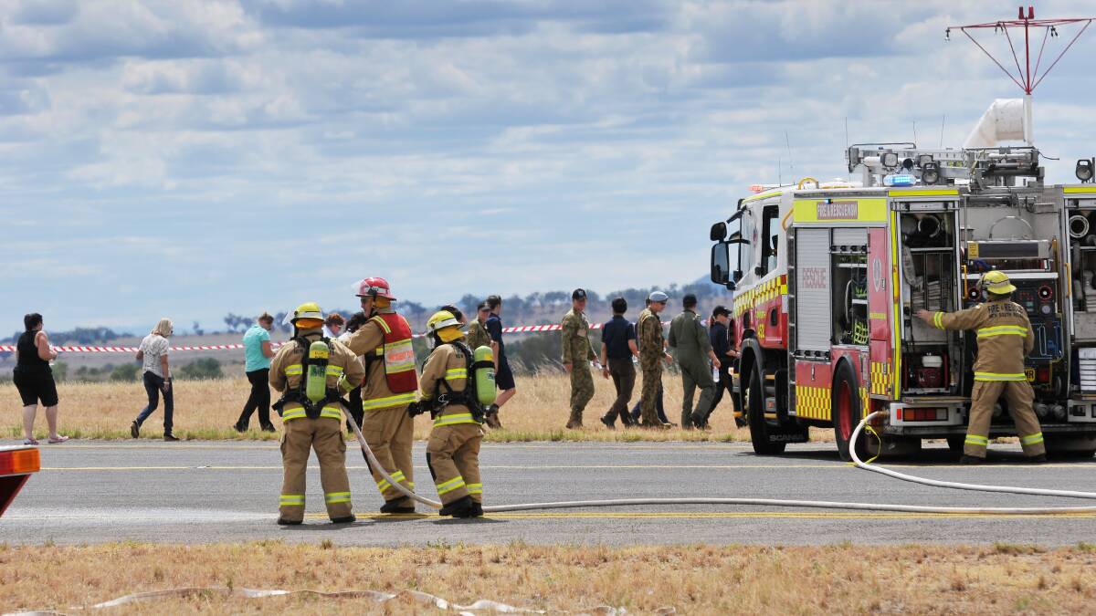 SAFETY FIRST: Emergency services go through the safety drill at Tamworth Airport yesterday. 
Photo: Gareth Gardner 040314GGC05
