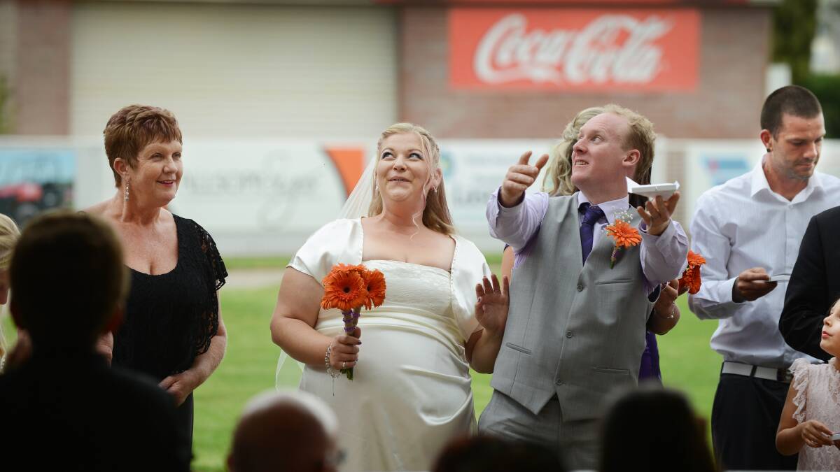 SPECIAL MOMENT: Rebecca and Adam Essery and guests released butterflies to conclude their marriage ceremony. Photo: Barry Smith 140214BSE39