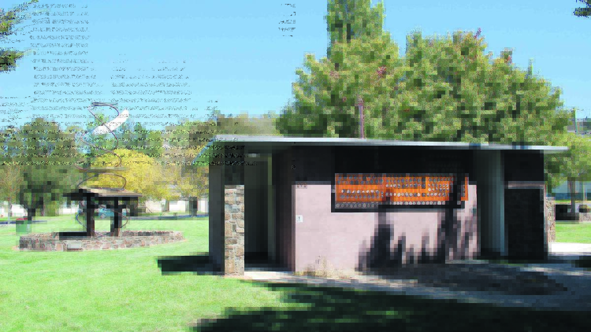 The toilet building features metal work by James Rogers and rock walls to compliment the sculpture in the park.