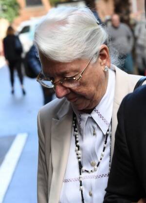 Ian Turnbull's, wife, Robeena Turnbull leaves the court after her husband was sentenced. Photo: Peter Rae