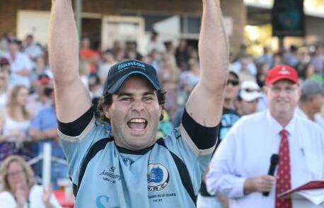 Narrabri captain Matt Schwager holds aloft the Heath Shield to cap a memorable day for the club in 2014.