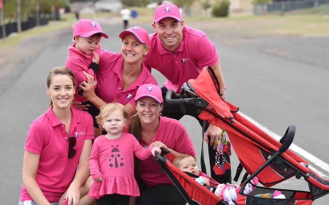 IN THE PINK: At the back : Ari Dunst, Julia Dunst and Anthony Dunst with, in front, Kaitlyn Dunst, Alexis Bartlett, Tara Bartlett and Piper Bartlett creating a sea of pink. Photo: Geoff O’Neill 080516GOA07