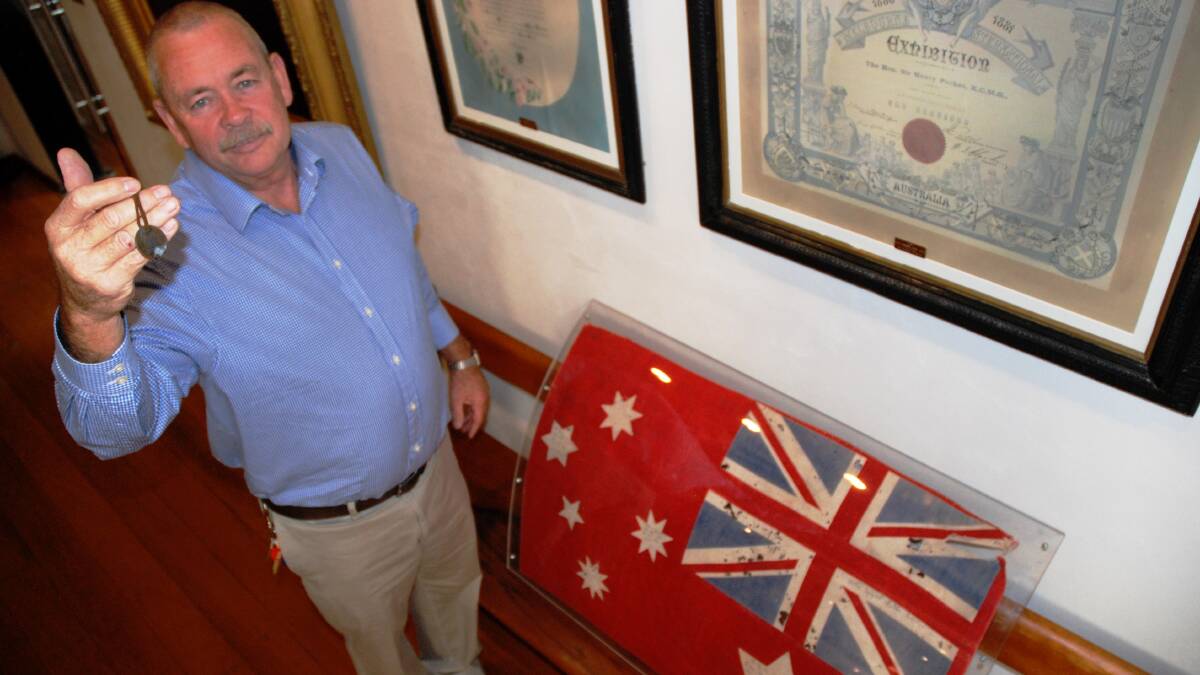 CREATING A STIR: Harry Bolton shows off the dog tag worn by Harry ‘Breaker’ Morant at his execution, and possibly the oldest Australian flag in existence.