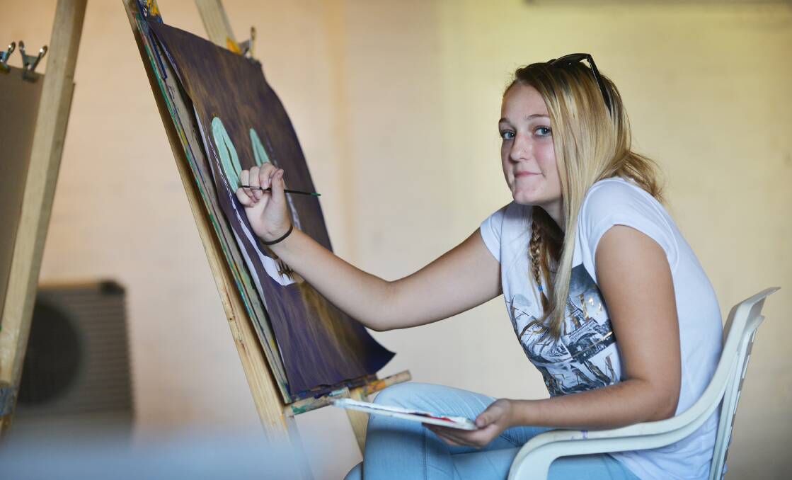 CREATIVE EXPERIENCE: Amelia Hill hard at work on her painting. Photo: Barry Smith 130416BSB06