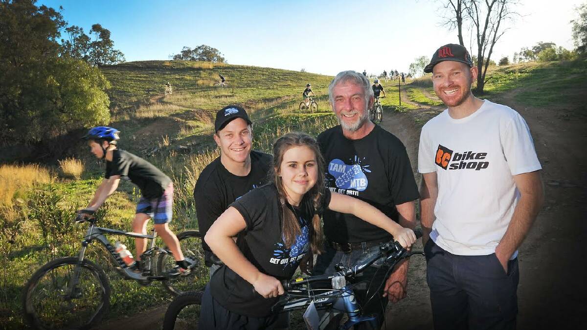 READY TO ROLL: Tamworth Mountain Bikers'  Liam Benson, Chloe Siddons and Ben Clark, along with Tamworth Regional Council depity mayor Russell Webb, are geared up for next year's rich 2015 Evocities MTB Series.  Photo: Gareth Gardner