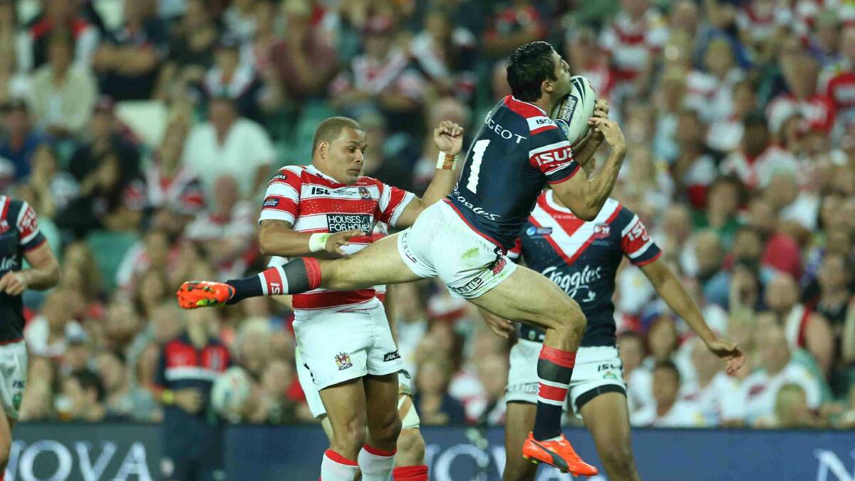 Anthony Minichiello goes high in the World Club Challenge game against Wigan Warriors at Allianz Stadium. Picture: Anthony Johnson