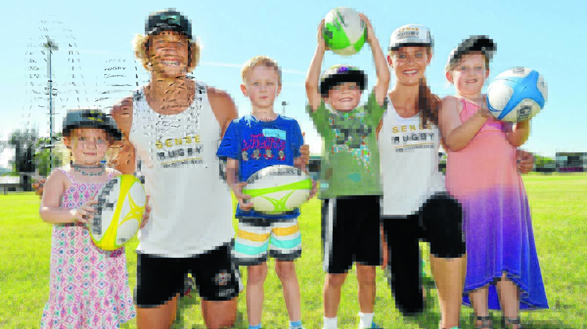 (L-R) Pyper Webster (3), Riley Webster (6), Jacob Beaton (5) and Tayla Webster (9) with Sense Rugby co-founders Jesse (second from left) and Carlien (second from right) Parahi during yesterday's session in Tamworth. 100116BSB03