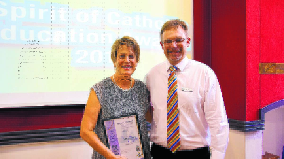 Leadership award winner Julie McGregor with McCarthy Catholic College principal Geoff McManus.