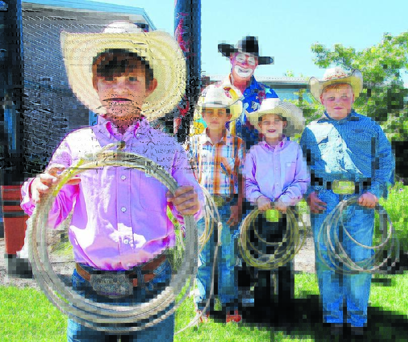 THINK PINK: Junior rodeo enthusiasts launch the campaign at Cancer Council’s Inala House. From left, Thomas Hutton, Dallon Finch, Big Al the rodeo clown, Olivia Priestley and Dusty Parkes. Photo: Jamieson Murphy 190116JM03
