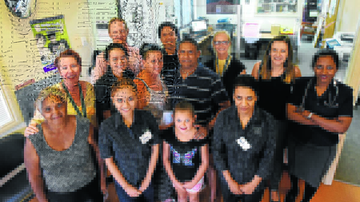 CULTURALLY DIVERSE: Pictured are some of the staff and clients at the Coledale Community Centre. Front row, from left, Cynthia Fernando, Jam Samonte, Kyiesha Carr and Anita Bista. Second row, Helen Cameron, Janice Sung, Michelle Carr and Mark Carr, and back row, Matt Crawford, Alejandro Ruiz, Sammy Hand, Alysha Luppino and Dr Suruchi Amarasena. Photo: Gareth Gardner 180116GGB03