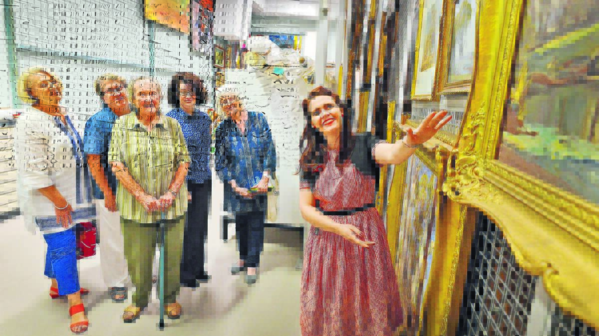 GALLERY DISPLAY: Tamworth Regional Gallery education officer Kate Armstrong gives a talking tour of Tamworth’s collection. From left, Penny Prentice, Claire Prentice, gallery officer Miranda Heckenberg and Margaret Schofield. Photo: Barry Smith 050416BSB04