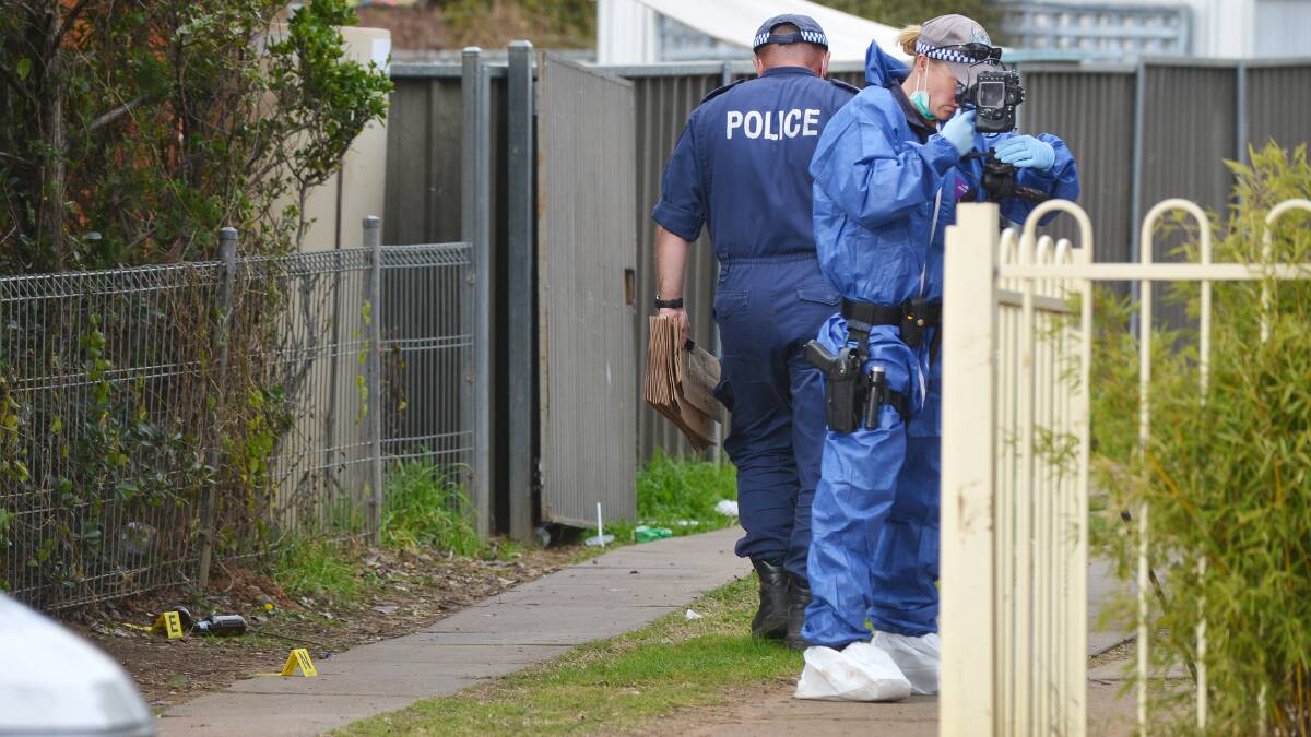 SEARCH FOR CLUES: Police placed evidence markers at the home of Johann Morgan, right, yesterday. Forensic police were combing the area in a bid to find the Tamworth mother. Photo: Barry Smith 210815BSG01