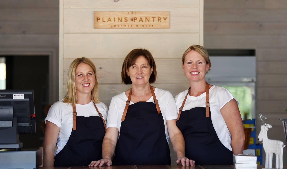 OPEN AT LAST: Hannah and Debbie Shaw and Kylie Turner are ready to open the doors of The Plains Pantry today. Photo: Gareth Gardner 031215GGA03