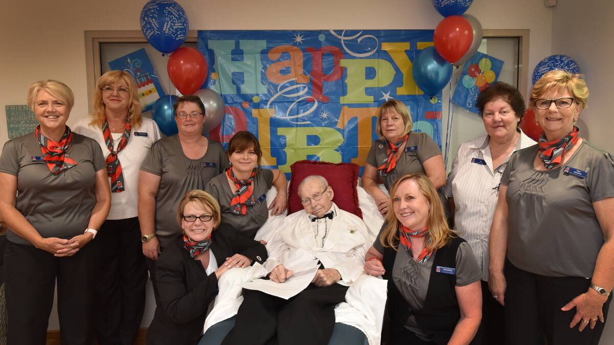 FAVOURITE FRIENDS: The birthday bloke, Lyall Green, was the centre of attention with many staff at Moonby House last month to mark turning 100 two weeks before. With Mr Green are, from  left back, Tracey Gibson, Stephanie Bellanto, Trudy Locke, Adi Goff, Debbie O’Shea and Lyn Brett, with Pam Corcoran (seated front), Wendy Williams and Bernardine Smyth. Photo: Geoff O'Neill 130116GOC07