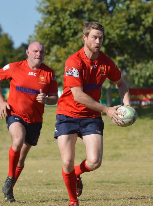Gunnedah's Cameron Mitchell takes on the Inverell defence as Matt Hannay looms in the background during last years Tier 2 prelminary final. The Red Devils are hoping for a big year on and off the field as they celebrate 125 years since the club was formed.  Photo: Samantha Newsam 160815SNA05