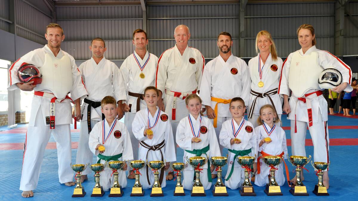 Back from a very successful Oceania Championships are Chaffey students  (front from left) Luke Leys, Evie Bower, Riley Leys, Bailey Bower and Amelia Cohen and (back from left) Scott Chaffey, Ken Holgate, Scott Cohen, Clint Chaffey, Mark Follington, Jane Cohen and Kristie Chaffey.  Photo: Barry Smith 121015BSB02
