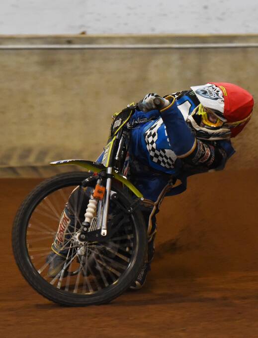 Jack Holder wrestles his bike into this corner on his way to third in the NSW Speedway titles at the AELEC on Saturday night.  Photo: Gareth Gardner 121215GGF024