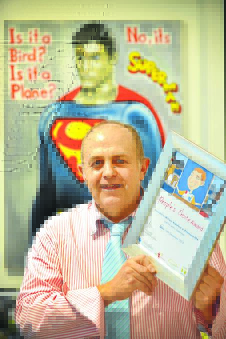 SUPER EFFORT: Tamworth artist Bill Wakeford won the people’s choice award in the Challenge Community Services art competition with his piece, Superman. Photo: Barry Smith 161215BSA04