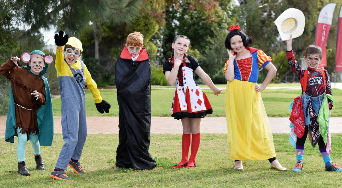 FUN: Book Week’s been brought to life at Carinya. From left, Noah Maxwell (Mouse), Felix Heilbuth (Kevin the Minion), Connor Wood (Dracula), Amber Downes (Queen of Hearts), Bailee Puls (Snow White) and Cee Jay Townsend (clown). Photo: Geoff O’Neill 280815GOC02