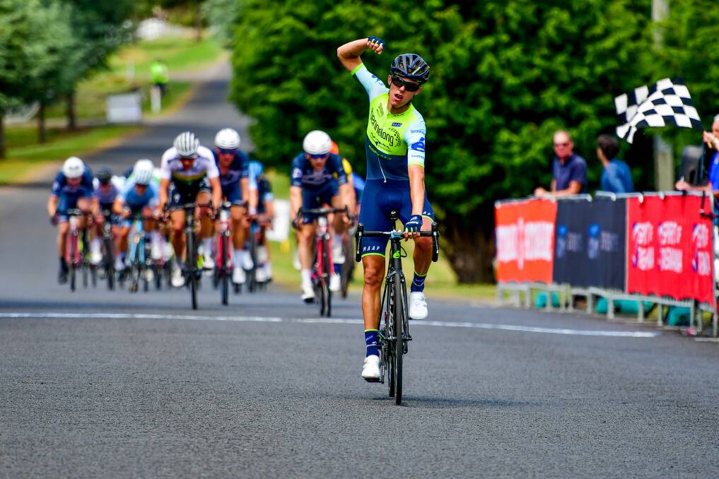Winning feeling: Dylan Sunderland celebrates his victory in the George Town to Grindelwald stage of the Tour of Tasmania cycling race. Picture: Scott Gelston