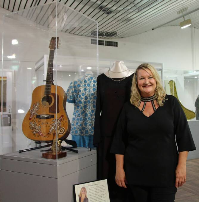 SHOWCASE: Tracy Coster with her exhibit on display at the Australian Country Music Hall of Fame during the festival. Photo: Rebecca Belt. 