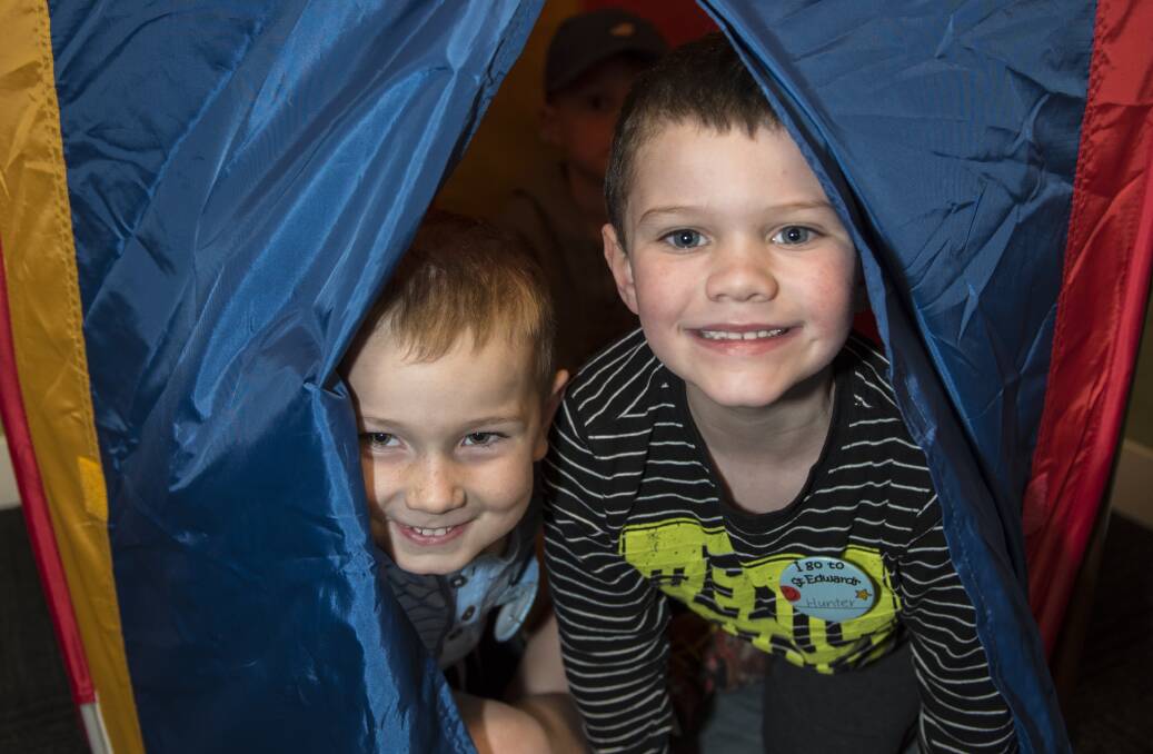 PEEK-A-BOO: Cooper Jones and Hunter Saddler hid in the kindergarten tent. 141016PHB07