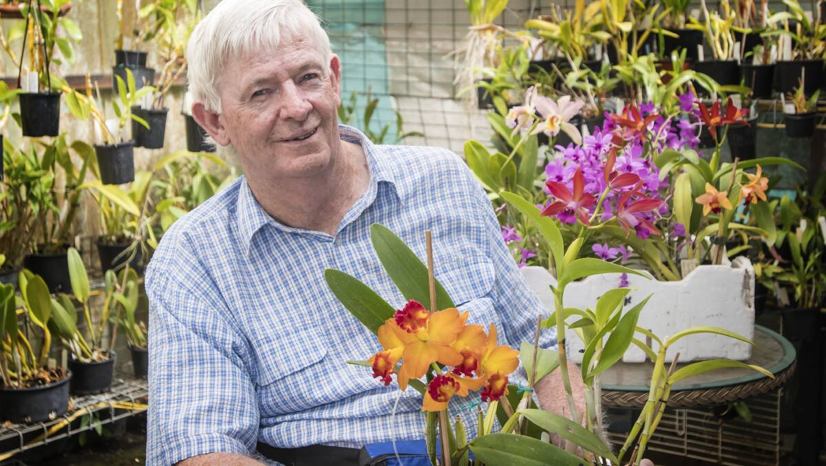 ON SHOW: Bob Harris with some of the Orchids to go on show at Tamworth Shoppingworld. Photo: Peter Hardin 030418PHD004