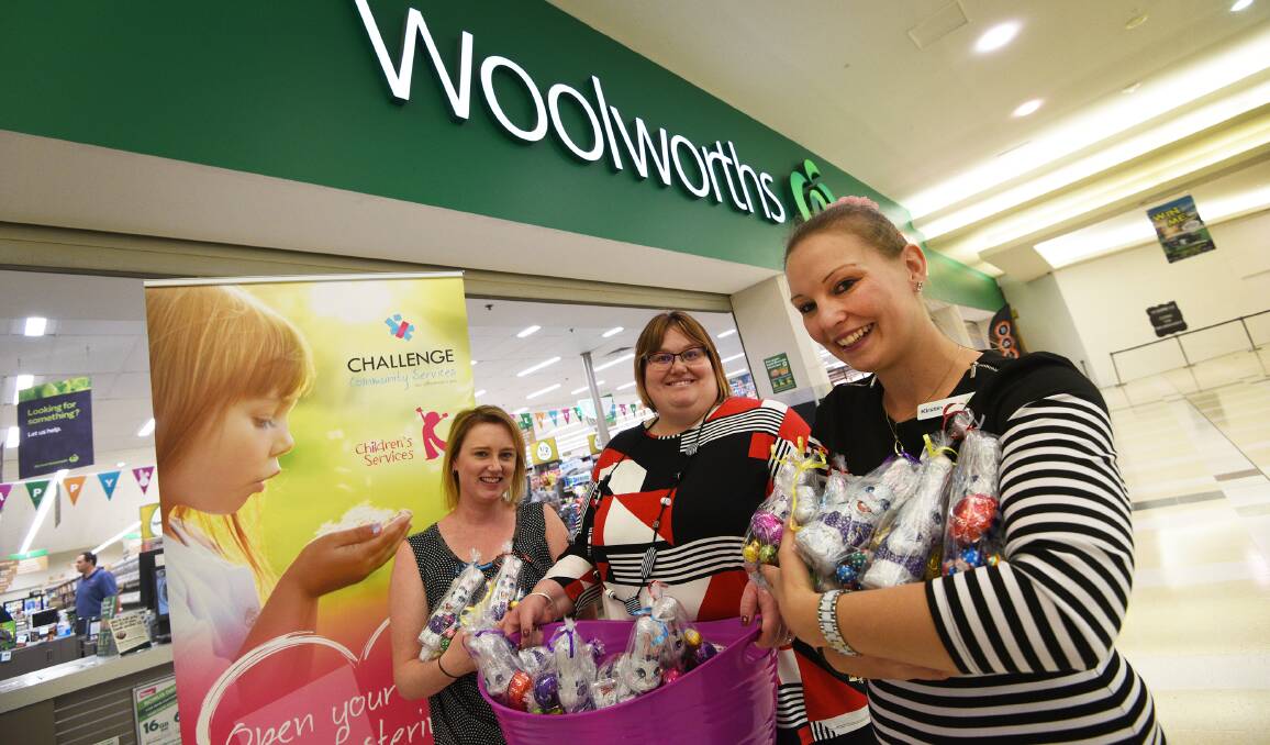 DONATION: Amanda Pearson and Alanna Holding of Challenge with Woolworths manager Kirstin Rossiter. Photo: Gareth Gardner 060417GGF02