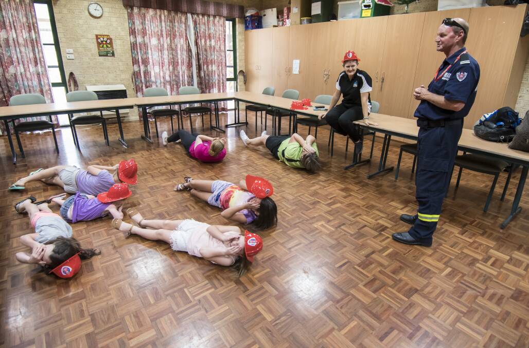 ENGAGEMENT: NSW Fire and Rescue's David Weir engages with some young people at the Coledale Community Centre. Photo: Peter Hardin