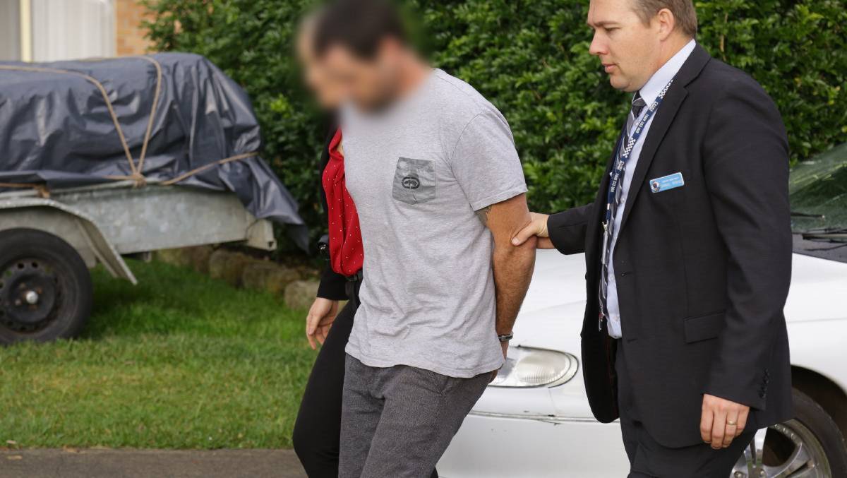 BREAKTHROUGH: Detectives arrest Sayle Kenneth Newson at his Buff Point home on June 19, 2017. On Wednesday he was committed to face a trial for the murder of his girlfriend of less than eight weeks, Carly Dawn McBride. Picture: NSW Police. 