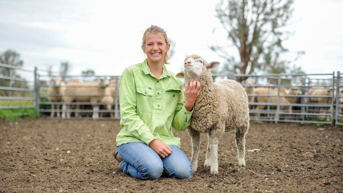 Claudia Kirton of Bilbrooke at Walcha with her favourite poddy, Mouton. Photos: Lucy Kinbacher