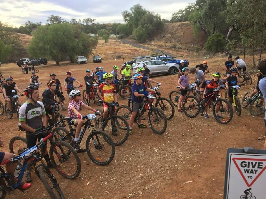 Set to go: Mountain bikers get a briefing from officials before taking to the hills last Wednesday. 