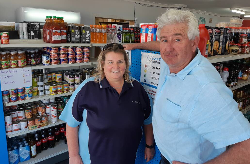 Helping hands: Liberty Foodcare manager Wendy Klasswen and Liberty Church pastor James Ardill.