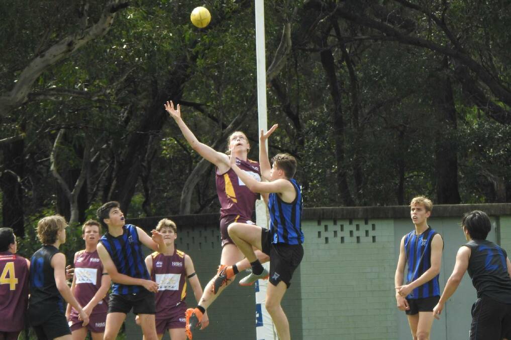 Up and at it: The NIAS Inverell RSM AFL Opens took on Knox College during their tour of Sydney.