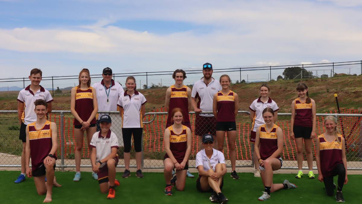 Members of the NIAS Athletics squad with coaches Adam Joliffe, Nick Price and Adrienne Ranken.