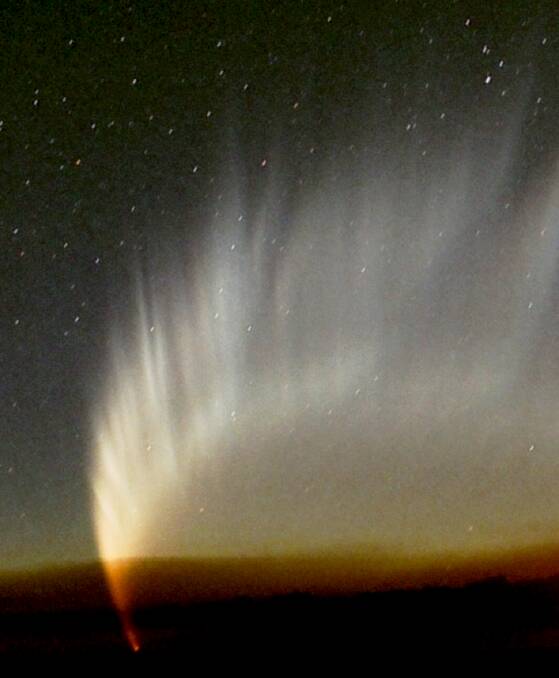 Comet C/2006 P1 McNaught: The head of the comet was obscured by bushfire smoke, but the tail appeared majestically above in all its glory. Photo Chris Wyatt