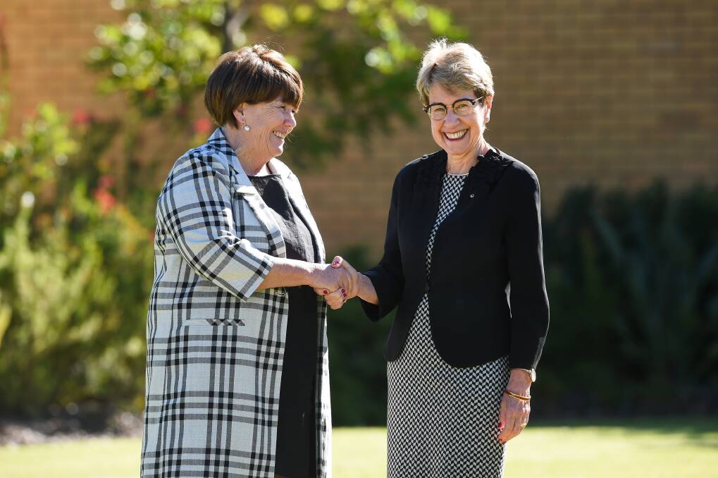 SESSIONS BEGIN: State president Annette Turner and NSW Governor Margaret Beazley shake hands after the official opening on Monday of the NSW Country Women's Association annual conference in Albury. Photo: Mark Jesser