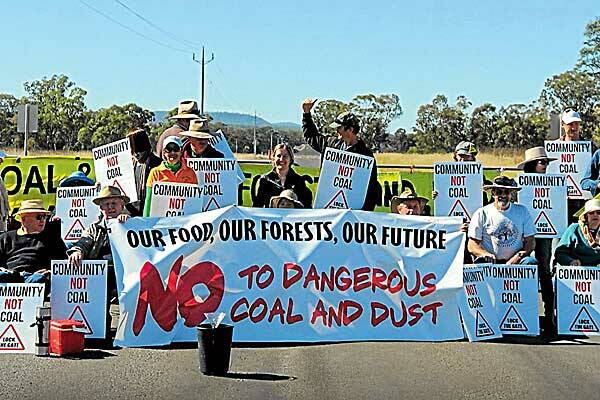 Not on: Protesters make their point outside the mine yesterday.