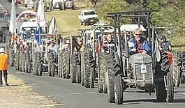 Slow march: A parade of grey Ferguson tractors rolled into Bendemeer over the weekend for the Grey Fergie Muster drawing crowds from across the region with everyone enjoying the great weather and checking out the hardworking fergies. Photo: Barry Smith