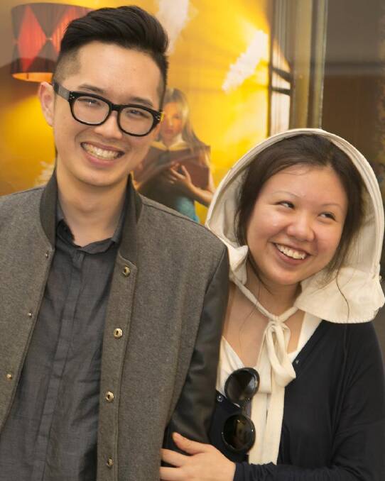Do you really wear the bonnet so people won't talk to you? 'Yes. And ever since I bought it, it?s been my thinking cap too.': Sara-Ann Sim (pictured with Jim Guo at Samantha Everton's exhibition opening).