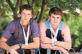 Josh Hazlewood (left) and Brock Bower with the medals they won at the National All Schools Athletics Titles in Sydney last weekend.