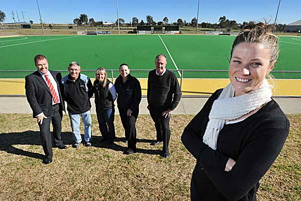 Tamworth’s newest Olympian Kate Jenner was congratulated and farewelled by hockey supporters including (from left) Tamworth Hockey Association president Chris Sheppeard, and former coaches and team-mates Tony Ball, Michelle Aslin, Cath Sumpter and Graeme McKenzie. Photo: Barry Smith 200612BSB11